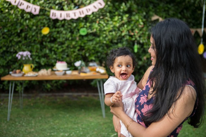 happy baby girl at her birthday party