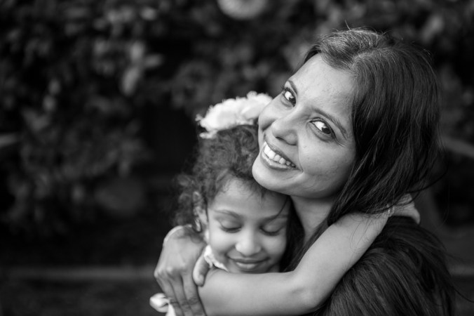 mom hugging daughter